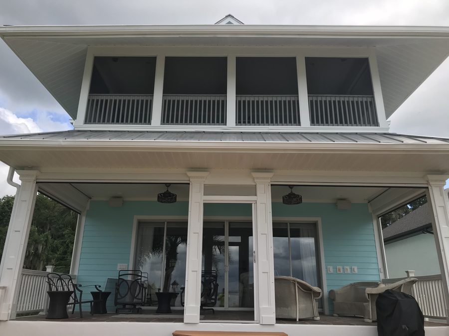 Blue residential exterior with white trim