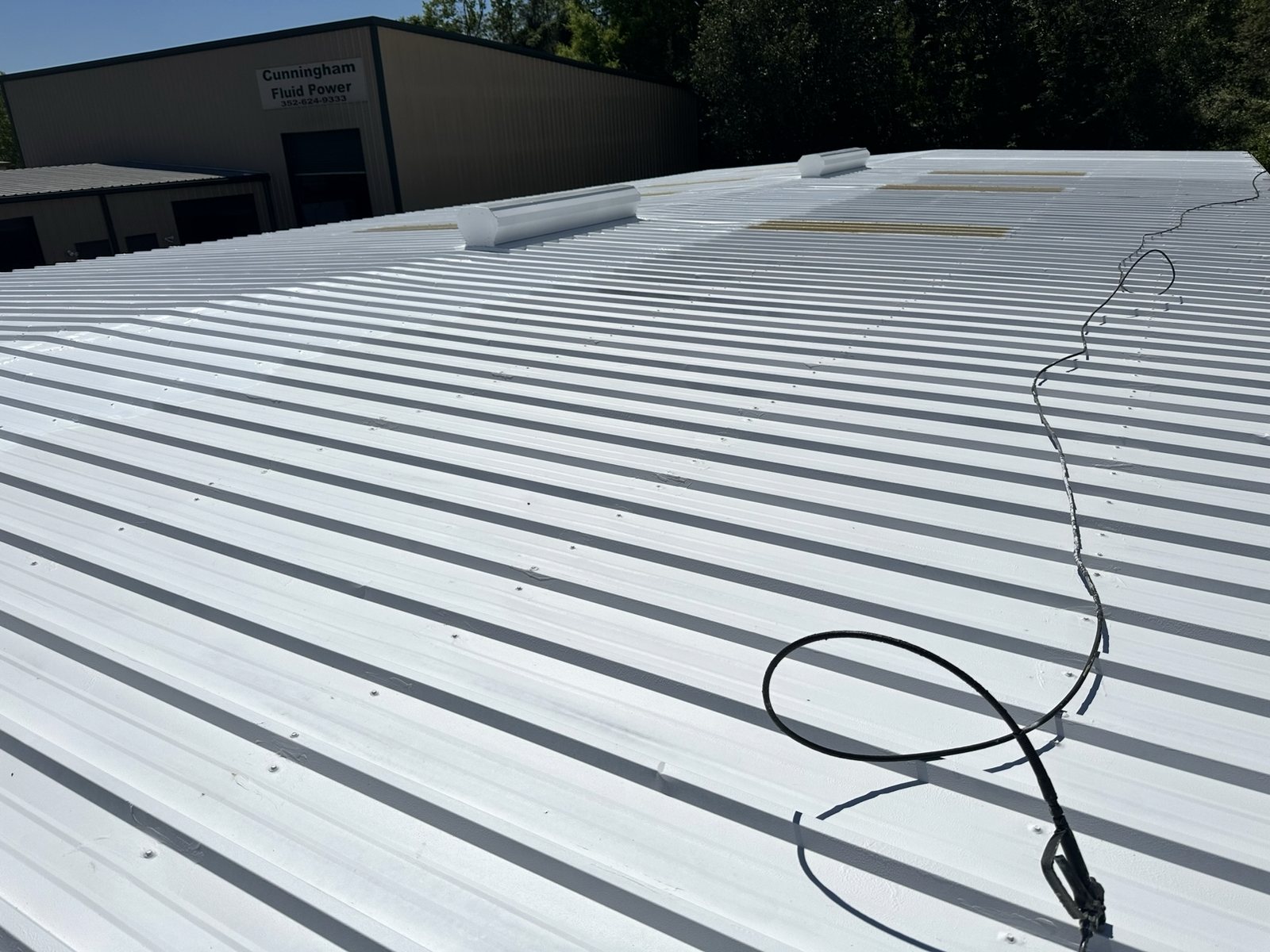 Finished white coating on a commercial metal roof
