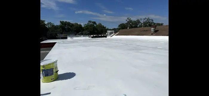 Finished liquid-applied roof coating on a low-slope roof