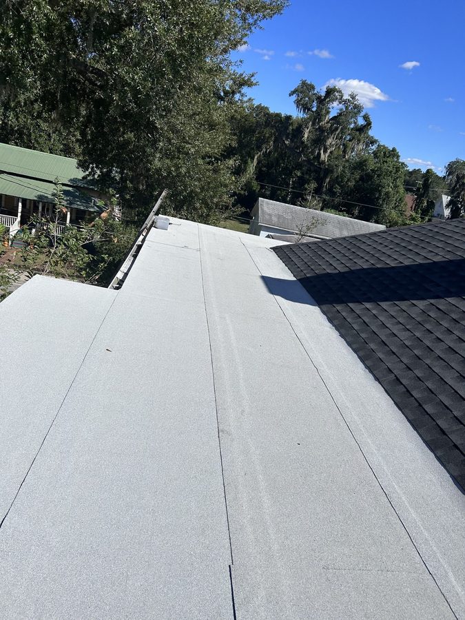 Low-slope roof area next to shingle roof transition