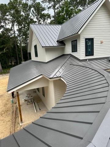 Finished standing seam metal roof on a custom residential home