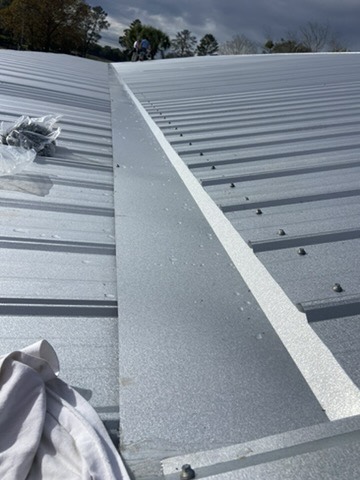 Metal roof valley flashing and panel installation detail