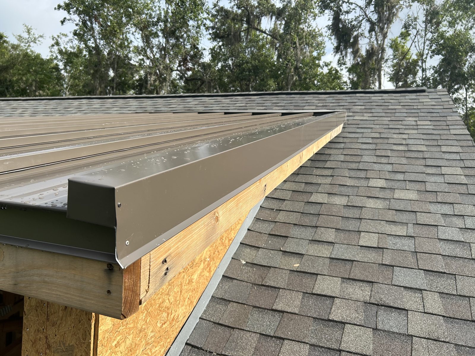 Close-up of finished shingle roof edge and eave detail